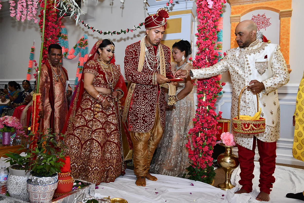 Hindu wedding pheras around the sacred fire