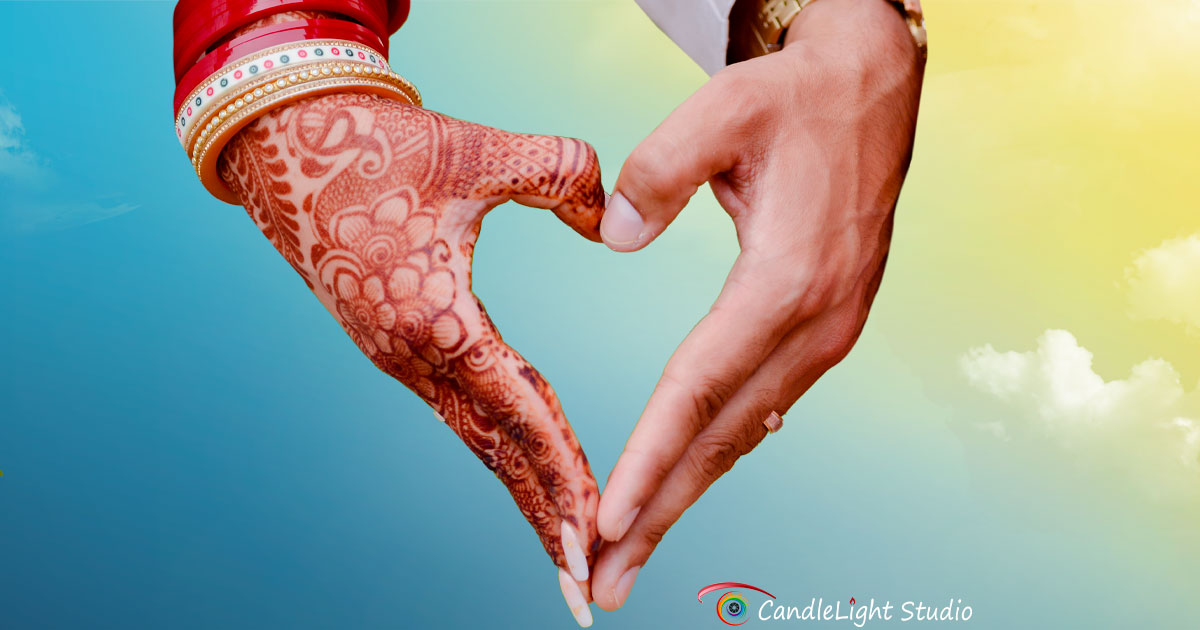 A couple in wedding attire, standing close to each other, smiling with happiness and love.